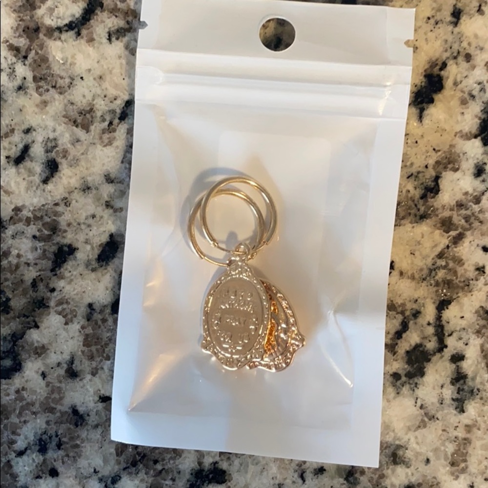 Brand new gold emblem earrings